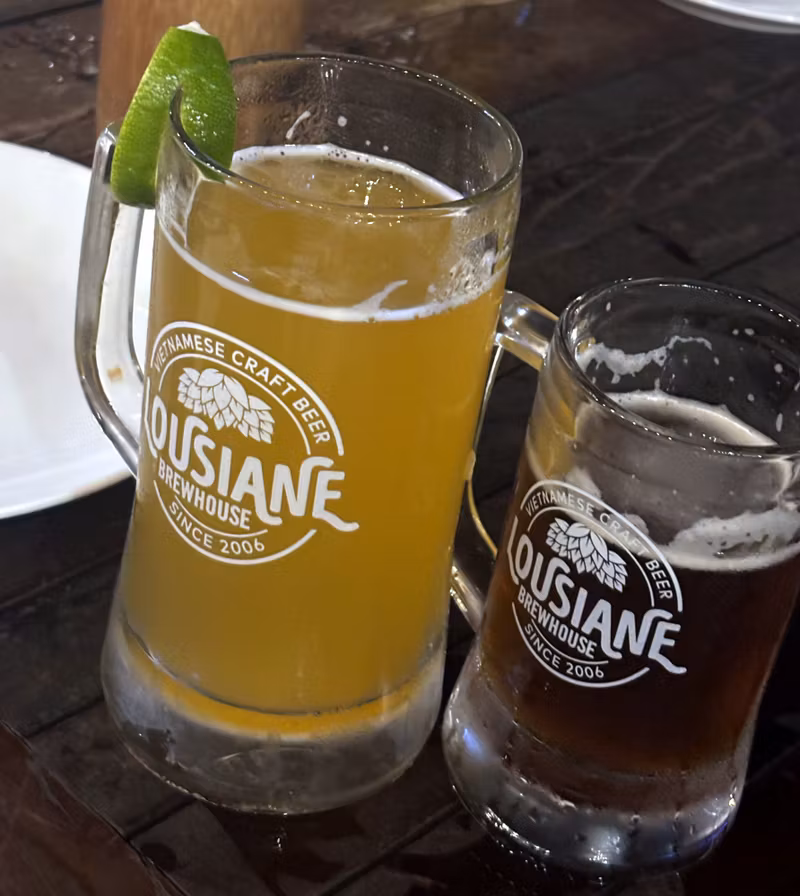 Two craft beer mugs at Louisiane Brewhouse, Nha Trang