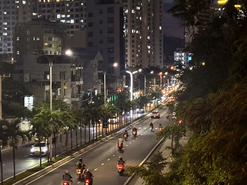 Nha Trang street at night with motorbike traffic