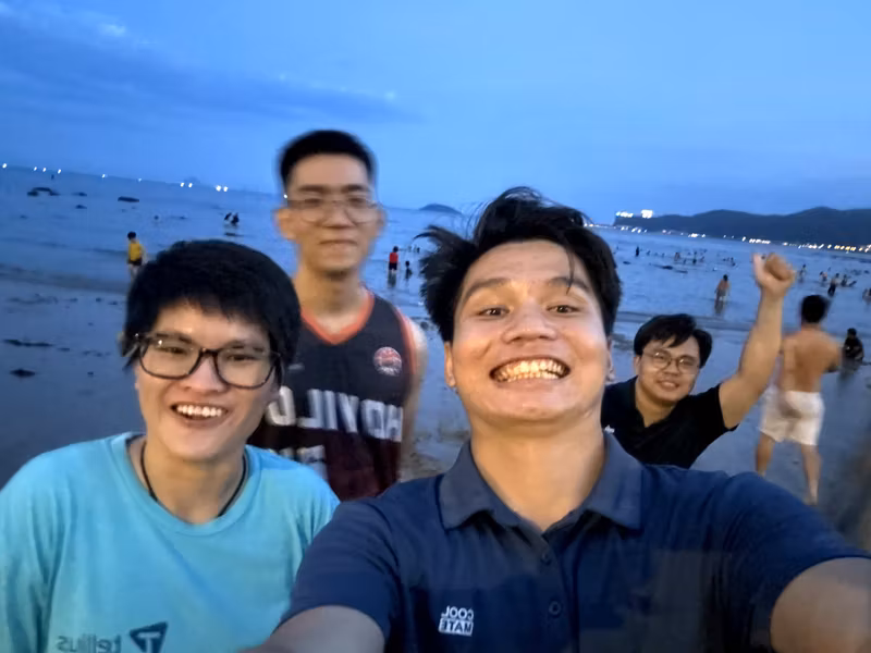 Group of friends on Nha Trang beach at dusk